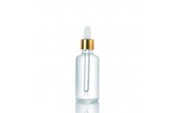 China Customized Empty Oil Glass Round Shoulder Bottle With Aluminum Dropper 10ML 30ML 50ML supplier