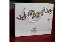 China Ecofriendly Handle Customized Paper Bags Hot Stamping With Logo Silver supplier