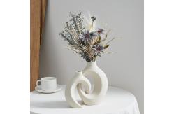 China Embrace Hollow Ceramic Vase for Modern Home Decor supplier