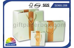 China Glossy Black Printed Paper Bags With PP Rope Handle , OEM / ODM Wrapping Bag supplier