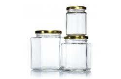China Food Grade Empty Clear Hexagonal Square Glass Empty Food Storage Jars supplier