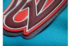 China Custom Logo Embossed Self Adhesive Clothing Patches , Silicone 3D Rubber Labels supplier