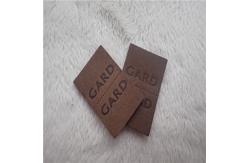 China Embossed Leather Woven Label With Dashed Points Convenient To Mid Fold supplier
