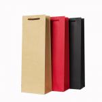 Varnished Hot Stamping Kraft Paper Wine Bags With Handles Beverage Packaging Solution for sale
