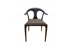 China Sculptural Ash Wood Dining Chair with Dynamic Lines and Tufted Leather Seat for Restaurants and Homes supplier