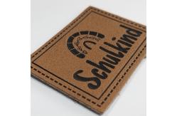 China Microfiber Embossed Logo PU Leather Label Sew On Clothing Customize Design supplier