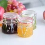 Popular Wholesale 100ml 180ml 280ml Food Grade Round Honey Glass Jar With Clip Cover for sale