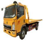 SINOTRUK HOWO 4x2 Right Hand Drive Car Carrier Wrecker Truck 420HP Flatbed Light Duty Recovery Truck For Road Rescue for sale