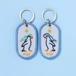 Heartwarming Penguin Pair Keychains | Bespoke Keepsakes | Double-Sided Embroidery | Starry Gradient Fabric for sale