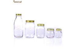 China Carved Flower Honey Glass Jar And Spoon Transparent Honey Container supplier