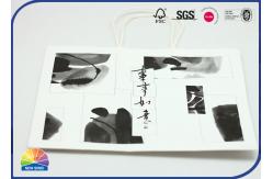 China 210gsm White Kraft Paper Gift Bag CMYK Print Customized With Handle supplier
