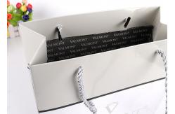 China Custom Printed Glossy Silver Paper Carrier Bags With Embossed Logo Suppliers supplier