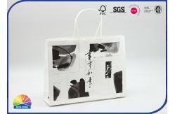 China Custom Printed White Kraft Paper Gift Bags With Twisted String Handles supplier