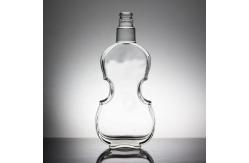 China Base Material Glass Bottle with Unique Letter Shape and Cork Cap supplier