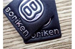 China Black Embossed Leather Patches With Silver Embossment TPU Logo For Bags supplier