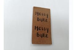 China Suede Microfiber PU Leather Label Washable With Embossed Logo supplier