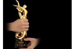 China Poly Resin Material Award Cups Trophies With Abstract Figure Design supplier