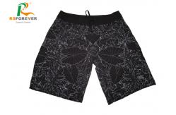 China Sublimated Black Beach Men Board Shorts With Side Pocket  Leaf Pattern supplier
