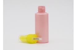 China Flat Shoulder Pink PET 50ml Small Plastic Spray Bottles Refillable With Yellow Pump supplier