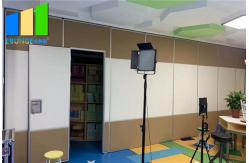 China Commercial Sound Absorbing Folding Partition Door With Pass Door supplier
