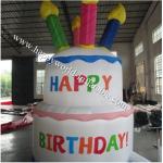 Bright and colourful, inflatable birthday cake saying happy birthday for sale