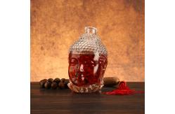 China Unique Buddha Head Shaped Glass Bottles with Aluminum Plastic PP Collar Material supplier