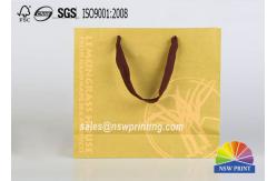 China Custom Recycle Brown Kraft Portable Paper Gift Bags With Screen Printing supplier
