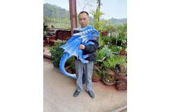 China Hand Puppet Simulation Blue Realistic Animatronic Dinosaur Baby With Wings supplier