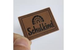 China Microfiber Embossed Logo PU Leather Label Sew On Clothing Customize Design supplier