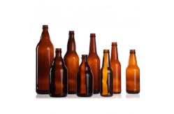 China Custom Bottle Beer Soda Beverage  Glass  With Top  Crown Cap supplier