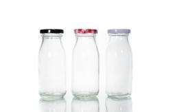 China Eco Friendly Frosted Bulk Glass Milk Bottles 16 Oz Kombucha Bottles With Lid supplier