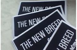 China Washable Black Polyester Custom Clothing Patches / Adhesive Embroidered Patches supplier
