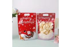 China Customized Printed Stand Up Pouch Zipper Christmas Gift Wrap Bags With Handle Hole supplier