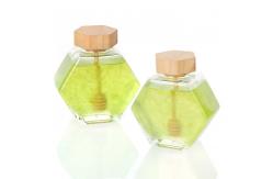 China 100ml 220ml Hexagonal Glass Food Jars With Lids Dipper For Honey supplier
