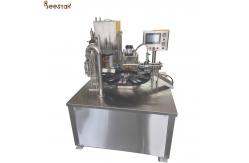 China SS304 Automatic Two Spoon Honey Packing Machine Honey Bottle Filler supplier