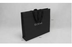 China Full Embossing Black Dyed Garment Paper Shopping Bags With Handles supplier
