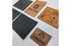 China Microfiber Embossed Logo PU Leather Label Sew On Clothing Customize Design supplier