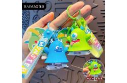China Monster Family Bag Toy Keychain Light Rubber With Gravure And Offset Printing supplier