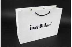 China Eco - friendly Customized Paper Bags With Handle For Apparel Packaging supplier