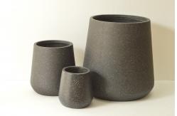 China Modern Round Fiber Clay Planter with Customed Design and Drainage Holes supplier