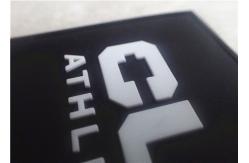 China Embossed White Character With Black Background Soft PVC Patches With Sewing Line supplier