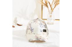China Six Panels Metal Patch Curve Brim Baseball Cap Floral Pattern supplier