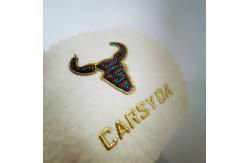 China Fashion And Lovely Oxhead Custom Clothing Patches Electroplating Embroidery supplier