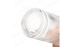 China Exquisite Carved Exterior Glass Bottle with Customizable Logo and Transparent Design supplier