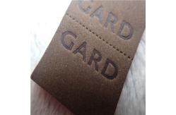 China Embossed Leather Woven Label With Dashed Points Convenient To Mid Fold supplier
