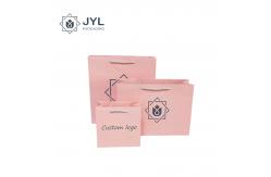 China Antibacterial Cosmetic Paper Bag With Ribbon Handle Dustproof Recyclable supplier