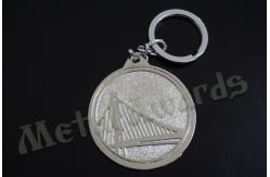 China Circle Design Bridge Metal Key Chains Metal Key Fobs Hard Enamel Customize Logo supplier