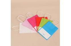 China Custom Logo Printing Reusable Kraft Paper Gift Packaging Bag With Handle supplier