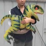 Cutest popular customizable large simulation waterproof Animatronic Dinosaur baby toy in hands for Theme Park for sale