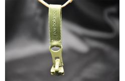 China Garment / Packback Different Coloured Metal Zip Sliders With Woven Labels supplier